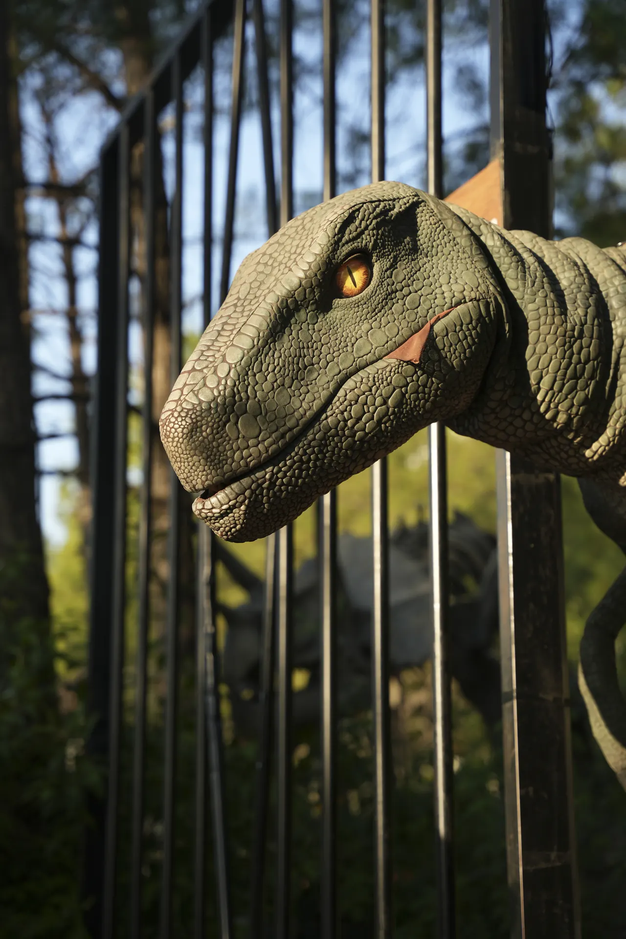 A dinosaur pressing its head through tall iron bars